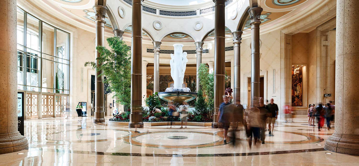 View of a grand lobby with a water fountain.