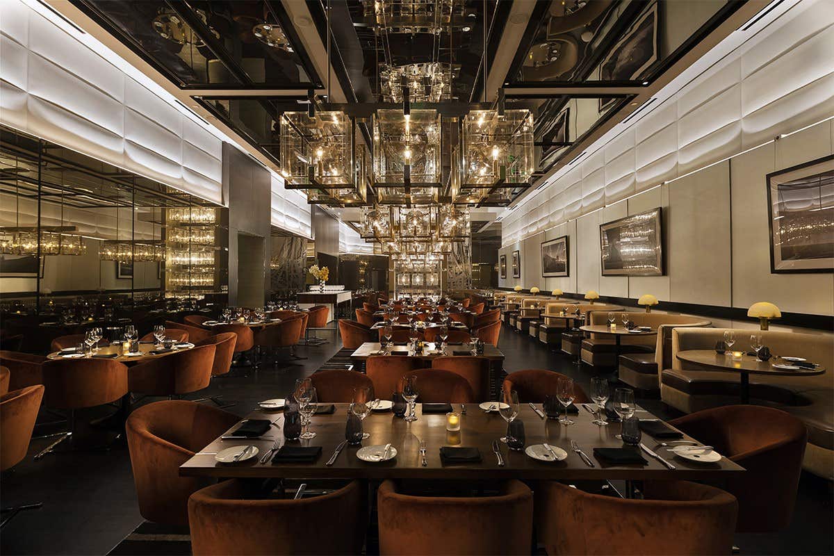 The CUT restaurant dining room lit up.